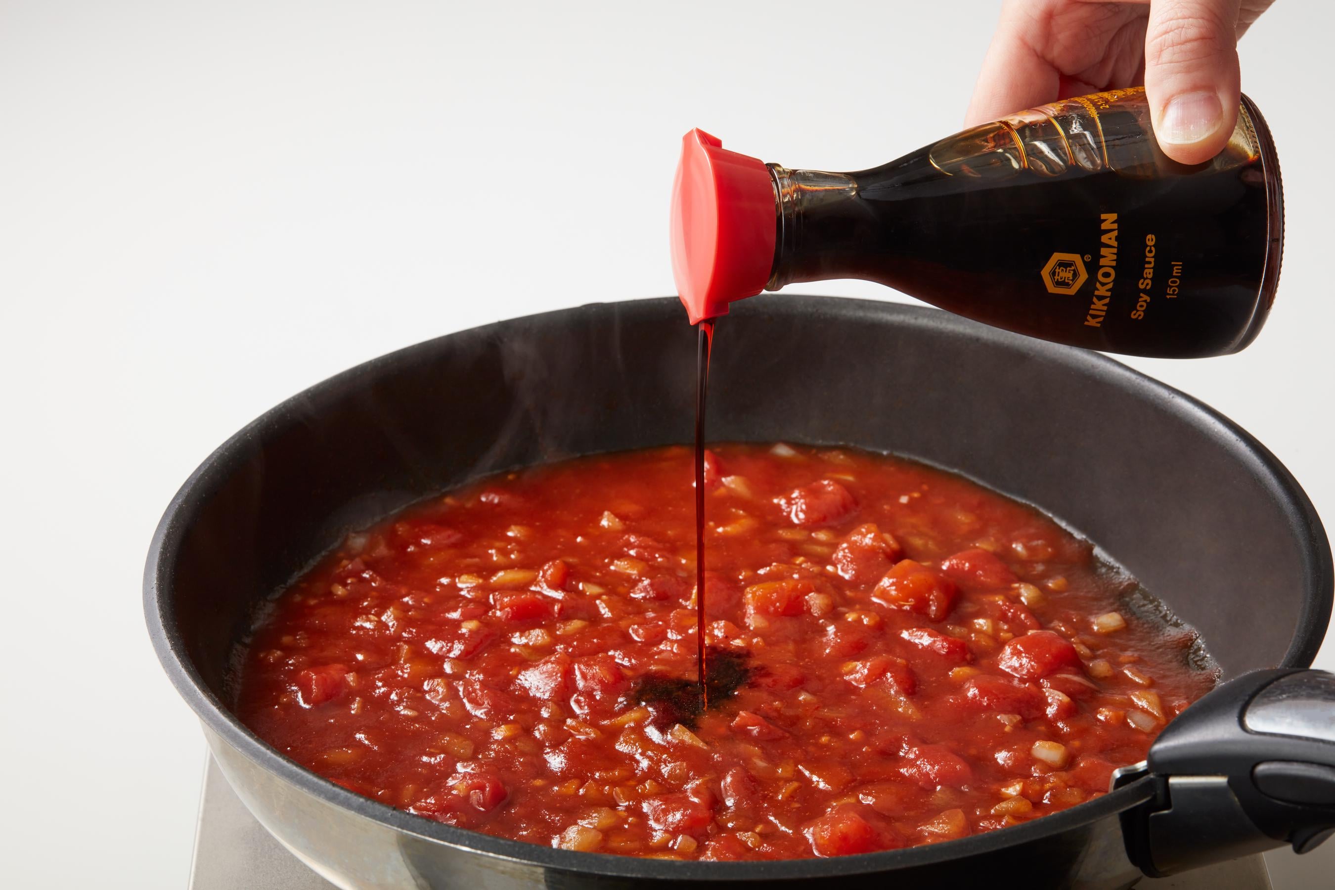 Seasoning the Monkey Gland Sauce with Kikkoman Soy Sauce
