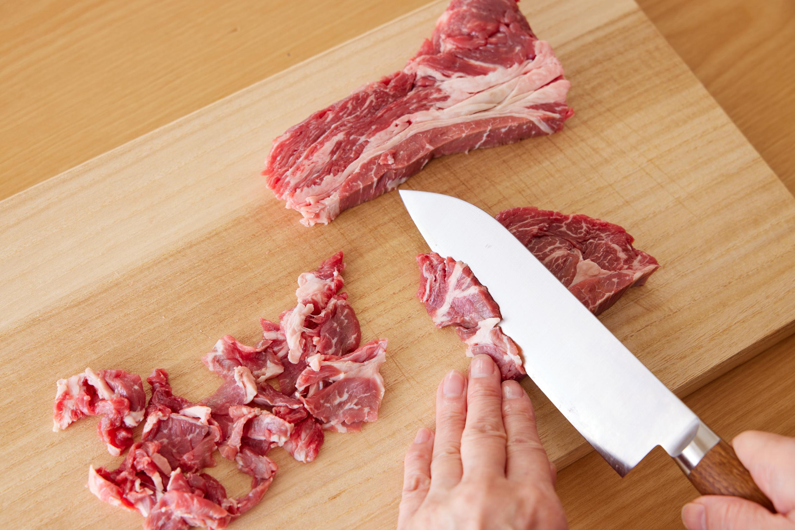 Slicing beef into thin pieces